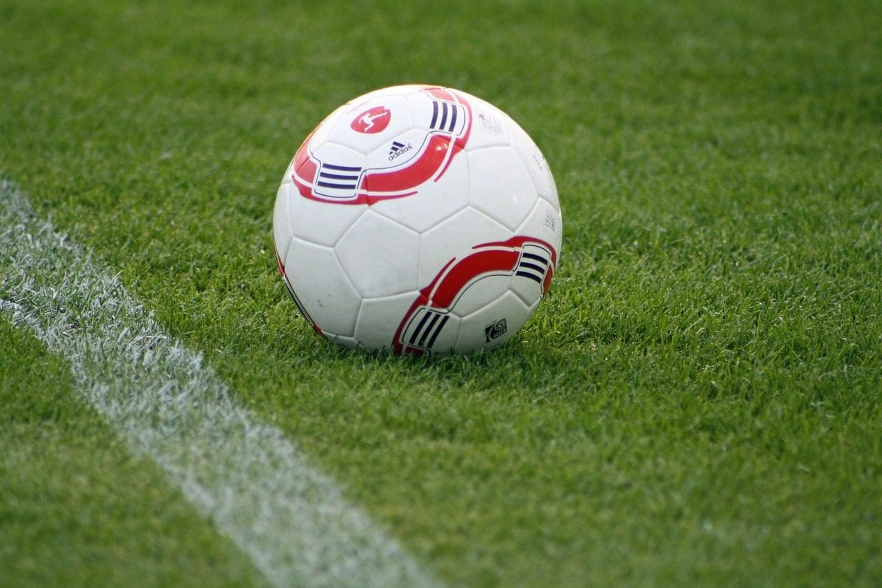 Football on a grass pitch