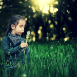 Photo of girl with dandelion clock