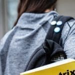 Student walking with bag and books