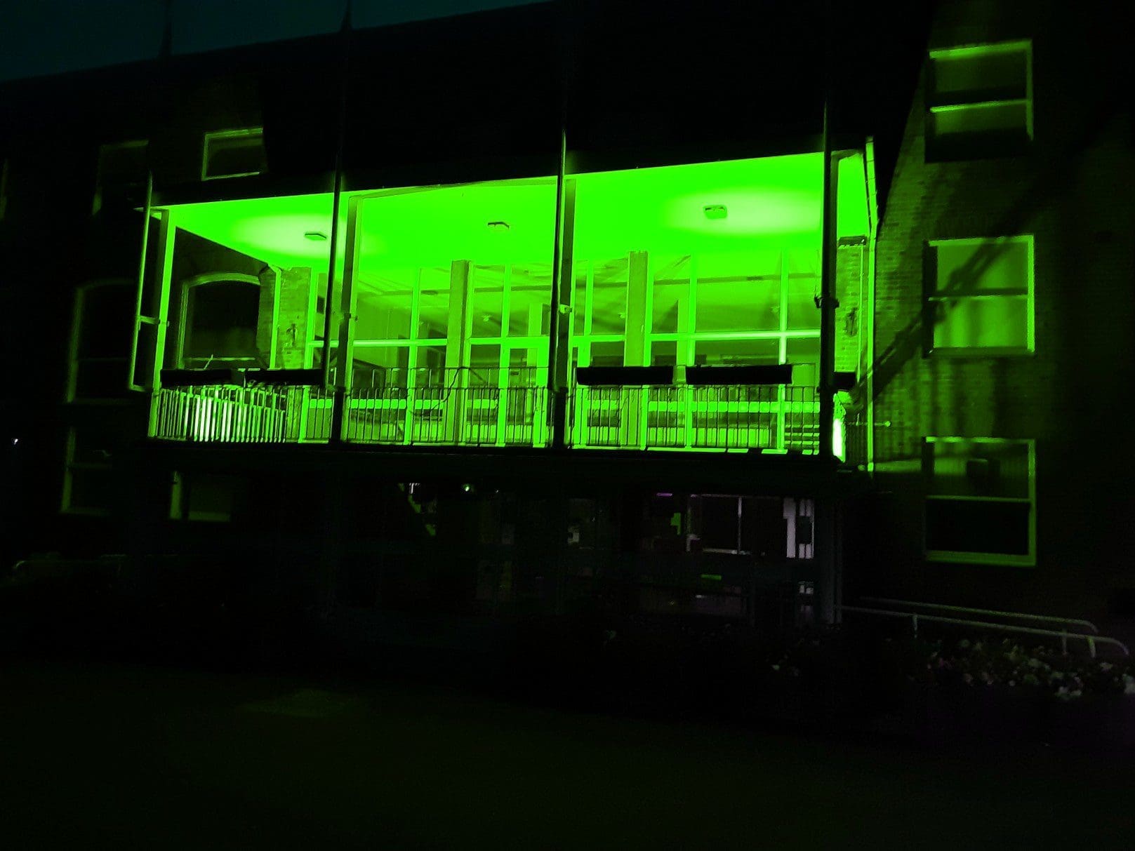 Guildhall front lit in green for Recycle Week 2021