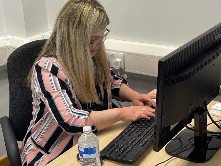 Jasmine at her desk working