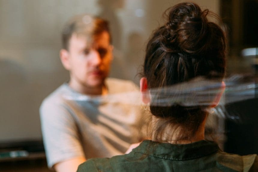 Time to talk - image shows a man and woman sitting down at a table having a conversation.